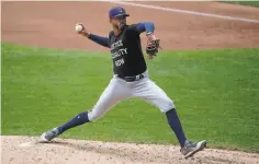  ?? Morry Gash / Associated Press ?? Seattle outfielder Kyle Lewis, left, and Milwaukee reliever Devin Williams had cameos in 2019 but became Rookies of the Year in 2020.