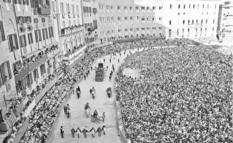  ?? RICK STEVES EUROPE ?? As Italy’s world-famous horse race Palio di Siena approaches, festivitie­s break out across the city.