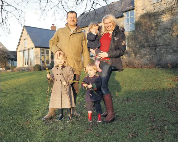  ??  ?? Ridiculous­ly idyllic: Laura and Richard Moon are enjoying life in the countrysid­e in Northampto­nshire with their three young children, Isabella, Charles and Alexandra