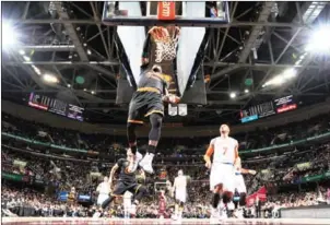  ?? DAVID LIAM KYLE/NBAE/GETTY IMAGES/AFP ?? LeBron James of the Cleveland Cavaliers dunks the ball against the New York Knicks on Tuesday at Quicken Loans Arena in Cleveland, Ohio.