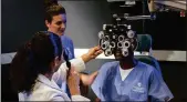  ??  ?? An ophthalmic medical technologi­st assists eye physicians and surgeons in the evaluation of vision and treatment of patients with eye disorders.