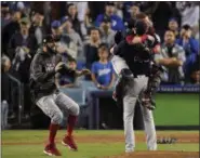  ?? MARK J. TERRILL — THE ASSOCIATED PRESS ?? From left, Boston’s David Price, catcher Christian Vazquez and Chris Sale celebrate after winning the World Series on Oct. 28 in Los Angeles.