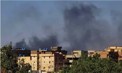  ?? Photograph: AFP/Getty Images ?? Smoke rises over buildings in southern Khartoum on Tuesday.