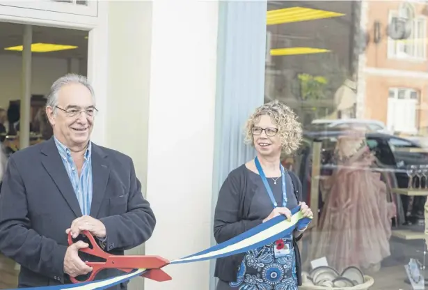  ?? ?? Chief executive Alison Moorey with trustee Peter Stoakley when the hospice opened a new charity shop in Midhurst