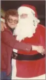  ?? SUBMITTED PHOTO ?? As an adult, Bette Banjack gives Santa a hug. The Christmas figure previously frightened her when she was a child.
