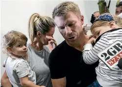  ?? BROOK MITCHELL/GETTY IMAGES ?? David Warner arrives back at Sydney Airport with his wife Candice and their children to face the music.