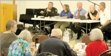  ?? Keith Bryant/The Weekly Vista ?? Bella Vista police Chief James Graves, top, left, addresses the crowd at the Senior Safety Academy on Oct. 10, along with animal control officer Amber Bowman, Ozark Regional Transit’s public informatio­n officer Jeff Hatley, Fire Department Capt. Leon...