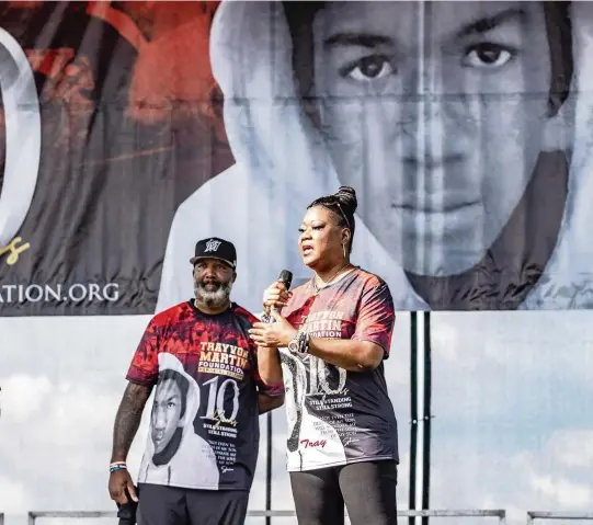  ?? PEDRO PORTAL pportal@miamiheral­d.com ?? Trayvon Martin’s father, Tracy Martin, and mother, Sybrina Fulton, speak during the annual Trayvon Martin Foundation Peace Walk and Peace Talk at Ives Estate Park in northeast Miami-Dade on Feb. 5.