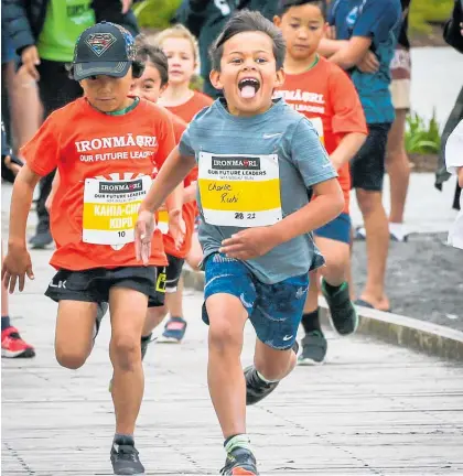  ?? Photo / Paul Taylor ?? Charlie Ruhi powers through the rangatahi event at IronMa¯ori in 2023.