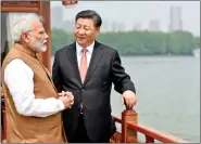  ?? IANS ?? Prime Minister Narendra Modi and Chinese President Xi Jinping inside a houseboat, in Wuhan on 28 April.