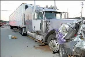  ?? Chattanoog­a Police Department via AP ?? This photograph shows a tractor-trailer and a Mazda Tribute after an accident that killed six people in Chattanoog­a, Tenn., in June 2015. The truck had been going 80 mph before crashing into a line of vehicles backed up in a constructi­on zone. The...