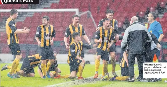  ??  ?? Winner Berwick players celebrate their last-minute goal against Queen’s Park