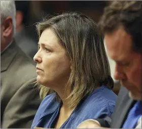  ?? BROOKE LAVALLEY — THE COLUMBUS DISPATCH VIA AP, FILE ?? Angela Wagner sits next to her lawyers in the Pike County Common Pleas Court for her arraignmen­t in Waverly on Thursday, Nov. 29, 2018. Wagner, her husband and sons are charged in the 2016Rhoden family shootings.