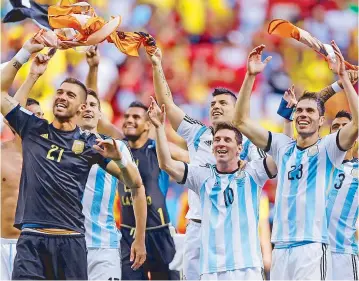  ??  ?? Argentina’s Lionel Messi (10) and his teammates celebrate following their 1-0 victory over Belgium to advance to the World Cup semifinals at the Estadio Nacional in Brasilia, Brazil.
AP