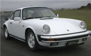  ??  ?? Outside, the USA friendly colour coded bumpers modernize the look of the car while the shape of the body shows little change. Below With the exception of the fatter, leather-lined steering wheel, the interior of an 80s 911 looks almost...