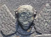  ?? Photograph­s: Iain Thornber ?? Kilmartin Parish Church built in 1834-5 and one of two gruesome winged angels of death carved on the lid of the Rev Archibald Malcolm’s tomb.