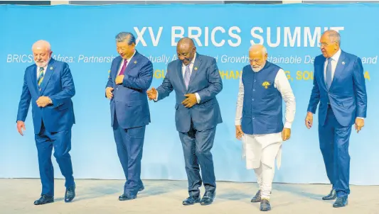  ?? AP ?? From left, Brazil’s President Luiz Inacio Lula da Silva, China’s President Xi Jinping, South Africa’s President Cyril Ramaphosa, India’s Prime Minister Narendra Modi and Russia’s Foreign Minister Sergei Lavrov pose for a BRICS group photo during the 2023 BRICS Summit in Johannesbu­rg, South Africa.
