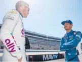  ?? SEAN GARDNER/GETTY ?? Kyle Larson, right, and Alex Bowman talk at practice for the DuraMAX Drydene 400 Saturday at Dover Motor Speedway in Dover, Delaware.