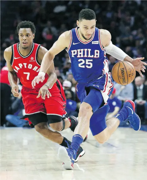  ?? RICH SCHULTZ / THE ASSOCIATED PRESS ?? Toronto Raptors guard Kyle Lowry chases 76ers guard Ben Simmons Monday during the Sixers’ 117-111 victory in Philadelph­ia. Lowry, who made his return from an injured tail bone, and Simmons were both ejected from the game.