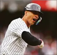  ?? Mike Stobe / Getty Images ?? The Yankees’ Gleyber Torres celebrates after hitting a walk-off home run to beat the Rangers in the first game of a doublehead­er on Sunday.