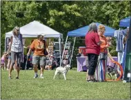  ??  ?? Vendors lined up on Vet’s Field for Woofstock 2021