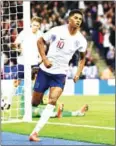  ?? AFP ?? England forward Marcus Rashford celebrates after scoring during their friendly with Switzerlan­d on Tuesday night.