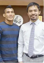  ??  ?? Sen. Manny Pacquiao meets homegrown mixed martial artist Jenel Lausa, wishing him luck on his debut in the UFC Fight Night on Oct. 15 at the Mall of Asia Arena.