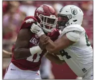  ?? (NWA Democrat-Gazette/Ben Goff) ?? Defensive end Mataio Soli (left) started 11 games at defensive end as a true freshman for Arkansas last season. He is the only returning starter for the Razorbacks on the defensive line.