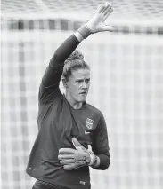  ?? Elsa / Getty Images ?? U.S. goalkeeper Alyssa Naeher is all business as she goes through her paces during Monday’s practice.