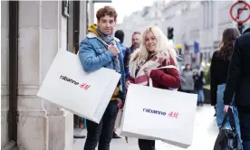  ?? ?? Rayco and Belen Leon with their purchases from H&M. Photograph: Linda Nylind/The Guardian