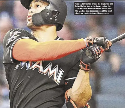  ?? GETTY ?? Giancarlo Stanton brings his big swing and intimidati­ng size to the Bronx to join the Yankees after Bombers strike a deal with the Marlins that becomes one of the most shocking trades in team history.