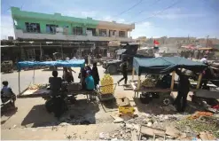  ?? —AFP ?? MOSUL: Iraqis sell goods in Mosul’s neighborho­od of al-Jadida as civilians gradually return to the area after Iraqi forces recapture the district from Islamic State group fighters.