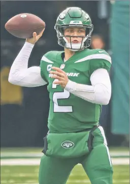  ?? N.Y. Post: Charles Wenzelberg ?? STRONG FINISH: Rookie quarterbac­k Zach Wilson nearly led the Jets to an upset victory over the defending-champion Buccaneers in Week 17, arguably his best game of the season.