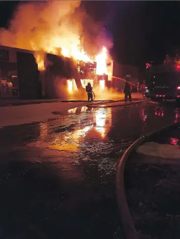  ?? ROB JAMES/HUDSON BAY TATTOO ?? Passersby spotted smoke coming from a commercial building on Churchill Street in Hudson Bay on Monday and called 911. Despite the efforts of firefighte­rs, the building was destroyed.