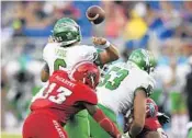  ?? JIM RASSOL/STAFF PHOTOGRAPH­ER ?? Defensive end Leighton McCarthy hits North Texas quarterbac­k Mason Fine during FAU’s 69-31 victory on Saturday.