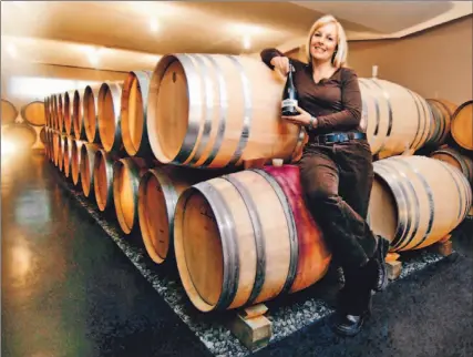  ?? KEITH BEATY/TORONTO STAR ?? Hospitalit­y manager Heidi Burch rolls out the barrels, so to speak, at Fielding Estate Winery. There are stellar wines to be found here.