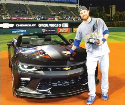  ?? | RON VESELY/ MLB ?? World Series MVP Ben Zobrist had to wait to collect his Chevy Camaro because of a very busy offseason.