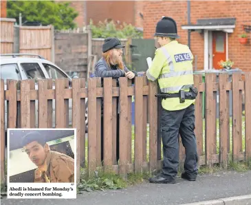  ?? LEON NEAL, GETTY IMAGES ?? Abedi is blamed for Monday’s deadly concert bombing.
A police officer speaks to a neighbor Wednesday as forensic teams search the Manchester home of Salman Abedi.