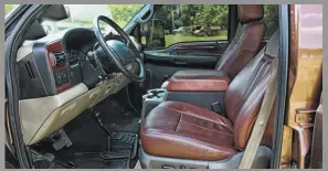  ??  ?? Thanks to his connection with a former supplier for the Louisville Super Duty plant, Ken scored a set of brand-new King Ranch seats originally intended for a ’14 model year truck. An ’08 center console adds considerab­le storage between the captain’s chairs.