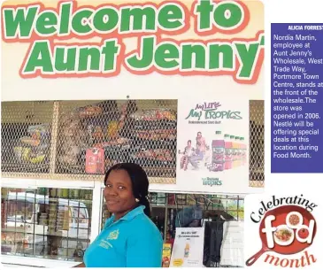  ?? ALICIA FORREST ?? Nordia Martin, employee at Aunt Jenny’s Wholesale, West Trade Way, Portmore Town Centre, stands at the front of the wholesale. The store was opened in 2006. Nestlé will be offering special deals at this location during Food Month.