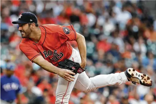  ?? Steve Gonzales / Houston Chronicle ?? Astros starter Justin Verlander delivers against the Rangers at Minute Maid Park on Friday night. He went six-plus innings, allowing a run on three hits.