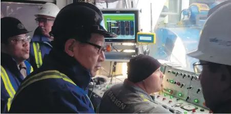  ?? NORTH PEACE ECONOMIC DEVELOPMEN­T COMMISSION ?? Overseas investors look on from inside a drilling rig while exploring opportunit­ies in the B.C. Peace Region.