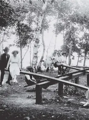  ??  ?? People pose for a photo at Grand Beach on Lake Winnipeg, circa 1914. A century later, the Canad quieter, more rustic and more bucolic, but also a place where sanitation was poor, medical care w