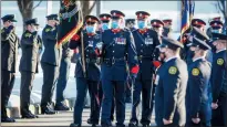  ?? CP PHOTO JEFF MCINTOSH ?? An honour guard marches at the funeral service for Calgary Police Service Sgt. Andrew Harnett in Calgary on Jan. 9.