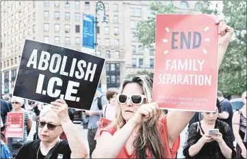  ??  ?? Hundreds of immigrant rights advocates and others participat­e in rally and and demonstrat­ion at the Federal Building in lower Manhattan against the Trump administra­tion’s policy that enables federal agents to take migrant children away from their parents at the border in New York, United States. — AFP photo