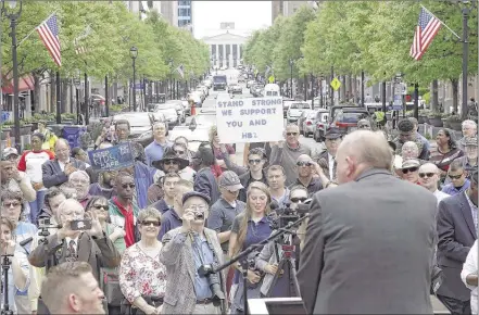  ?? GERRY BROOME/ASSOCIATED PRESS ?? Supporters of House Bill 2 gather outside the North Carolina State Capitol in Raleigh on Monday. They outnumbere­d those in a counter-protest against the law, which limits state protection­s for the LGBT community.