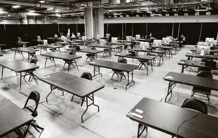  ?? Tom Reel / Staff photograph­er ?? A workspace is outfitted and ready for additional personnel this week and into August as Metro Health increases its contact tracing efforts with a large space in the Alamodome.