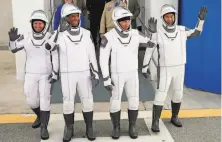  ?? John Raoux / Associated Press ?? Shannon Walker ( left), Victor Glover, Mike Hopkins and Soichi Noguchi prepare for launch from Cape Canaveral.