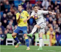  ?? AFP ?? Cristiano Ronaldo (right) vies for the ball with Las Palmas’ Daniel Castellano during the Spanish league match. —