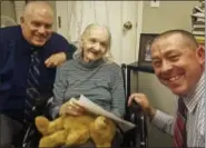  ?? AP FILE PHOTO ?? This October 2017 file photo provided by the Sullivan County Sheriff’s Office shows Flora Harris, center, with Sullivan County Sheriff’s Detective Sgt. Ed Clouse, left, and Detective Rich Morgan at an assisted living residence in Lowell, Mass.